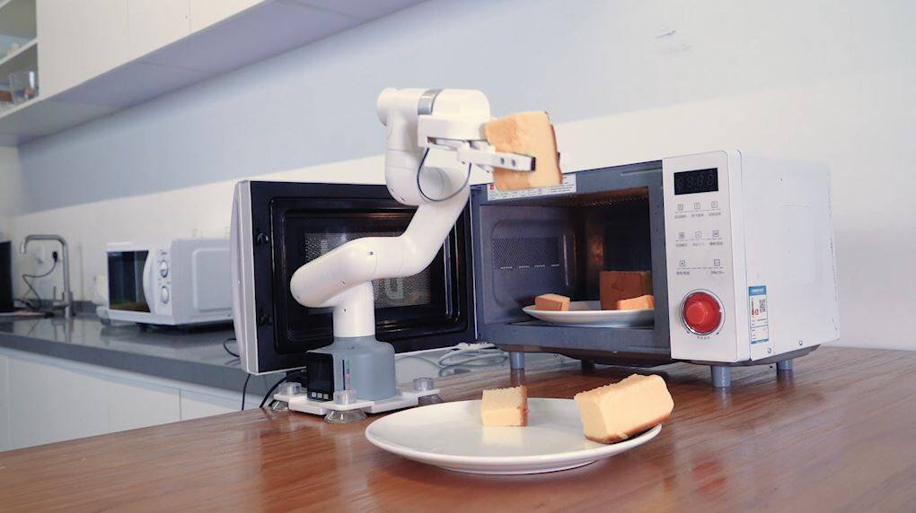 cobot take cakes from micro oven